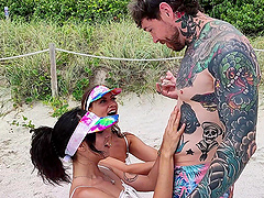 Four sexy people have a great fun on the beach with dan