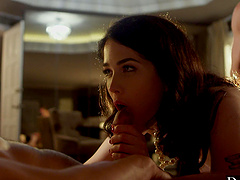 Two guys share a hot brunette's pussy in an intense threesome scene.