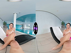 Stunning brunette Vixi Rafi enjoys solo play by the pool.