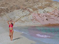 The couple has sex on the beach with a big cock in bikini