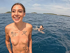 Lesbian sex of two young beauties on the yacht in nature