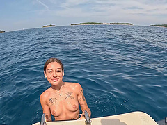 Lesbian sex of two young beauties on the yacht in nature