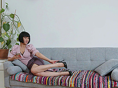 Cougar Black Kat flaunts her big booty in a skimpy skirt