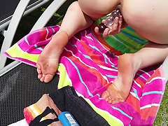 Redheaded Lea's tight slit teased outdoors with sex toys