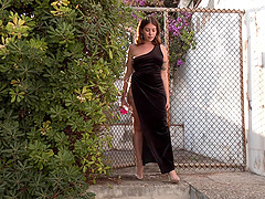 Brown-eyed MILF with a plump body rubs her ink-covered curves alone outside