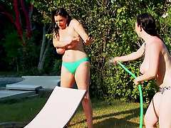 Curvaceous Michelle and Karina in a steamy poolside rendezvous