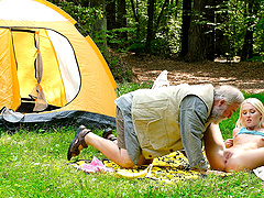 Young Lovita pleases her silver fox in the great outdoors