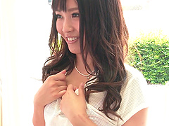 Japanese babe Yuzuna Oshima flaunts her natural tits and long hair in a seductive thong