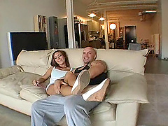 Hot couple in a wild hardcore sex scene on the sofa.