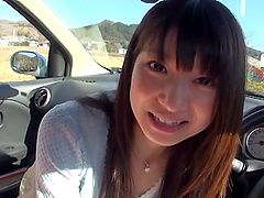 Kinky asian gives a blowjob in the car to her her man.