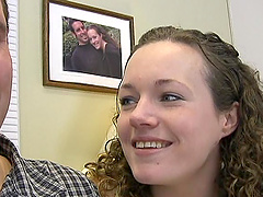 An amateur girl with curly hair fucks her hubby in a bedroom