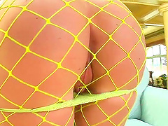 Blonde cutie Gil, wearing fishnet pantyhose, slams her vag with a dildo