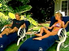 Babe in a bikini gets fucked outside in the back yard