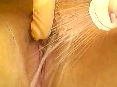 Babe in the bathroom taking a shower and and masturbating