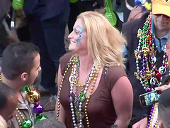 Amateur slut flashes her tits during a carnival in the street