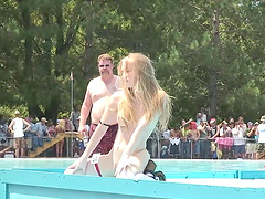 Flirtatious cowgirl with natural tits performs a wild striptease show outdoors