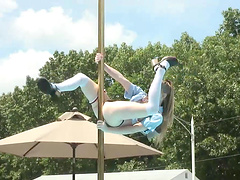 Flirtatious cowgirl with natural tits performs a wild striptease show outdoors