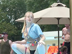 Flirtatious cowgirl with natural tits performs a wild striptease show outdoors