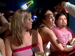 Slutty cowgirl in a revealing miniskirt shows off her nice ass at a wild club party