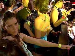 Slutty cowgirl in a revealing miniskirt shows off her nice ass at a wild club party