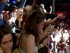 Slutty cowgirl in a revealing miniskirt shows off her nice ass at a wild club party