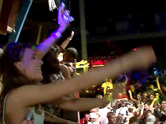 Slutty cowgirl in a revealing miniskirt shows off her nice ass at a wild club party