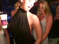 Horny party girl in a revealing miniskirt fondling her tits