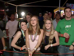 Some lewd chicks flash their tits and butts in a public place