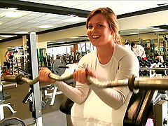 A stacked amateur shows her tits while working out in the gym