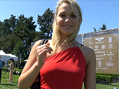 Glamorous reality cowgirl in a sexy dress poses seductively outdoors